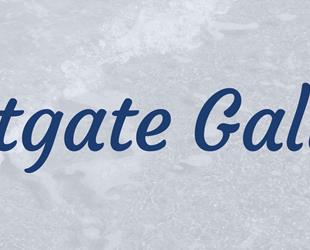 Dark blue italic text Westgate Galleria against a pale blue background