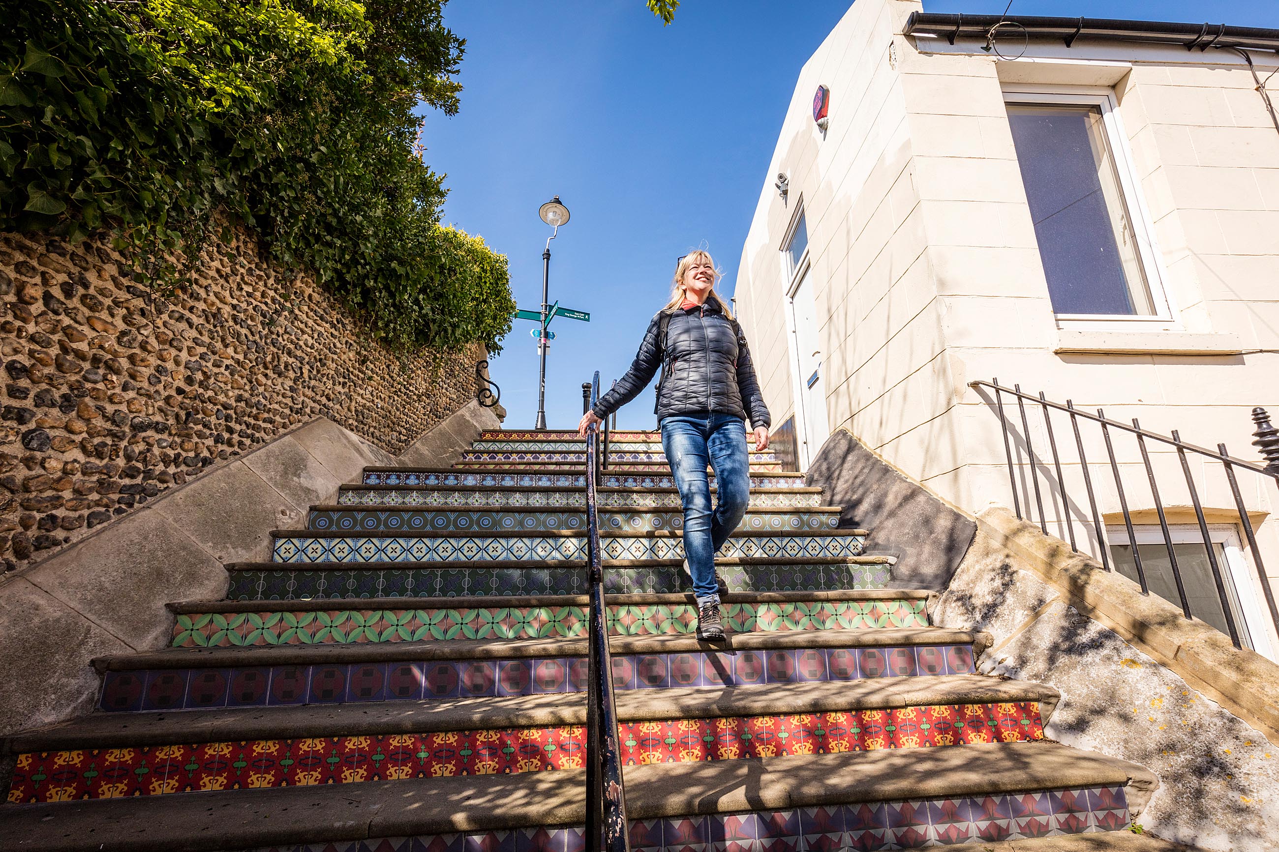 Lady walking down Pugin Steps DS5 7274
