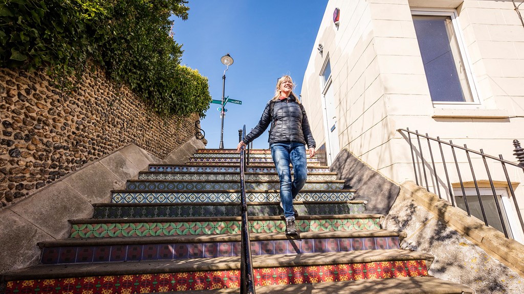 Lady walking down Pugin Steps DS5 7274